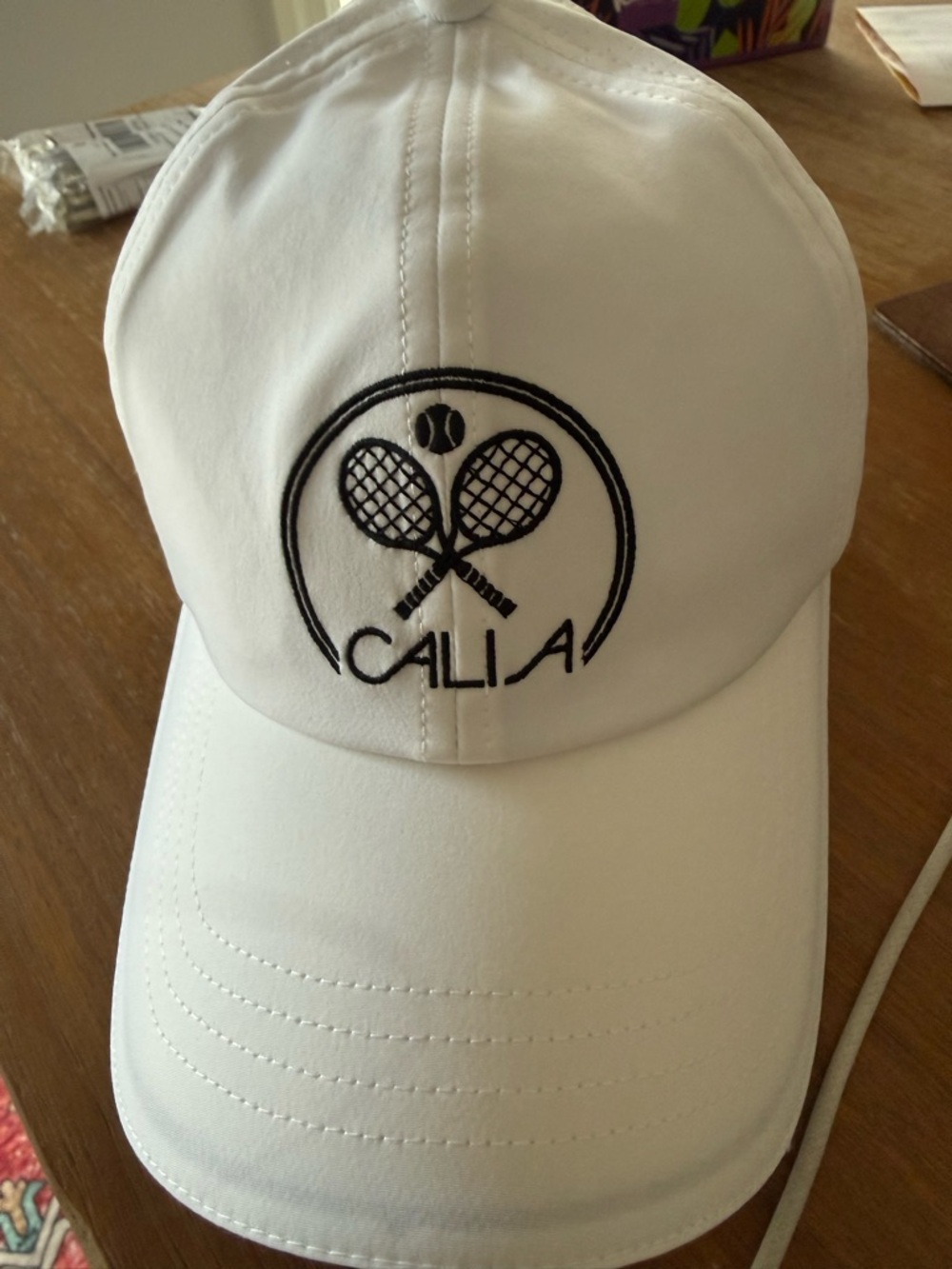CALIA by Carrie Underwood White Baseball Cap with Black Tennis Logo